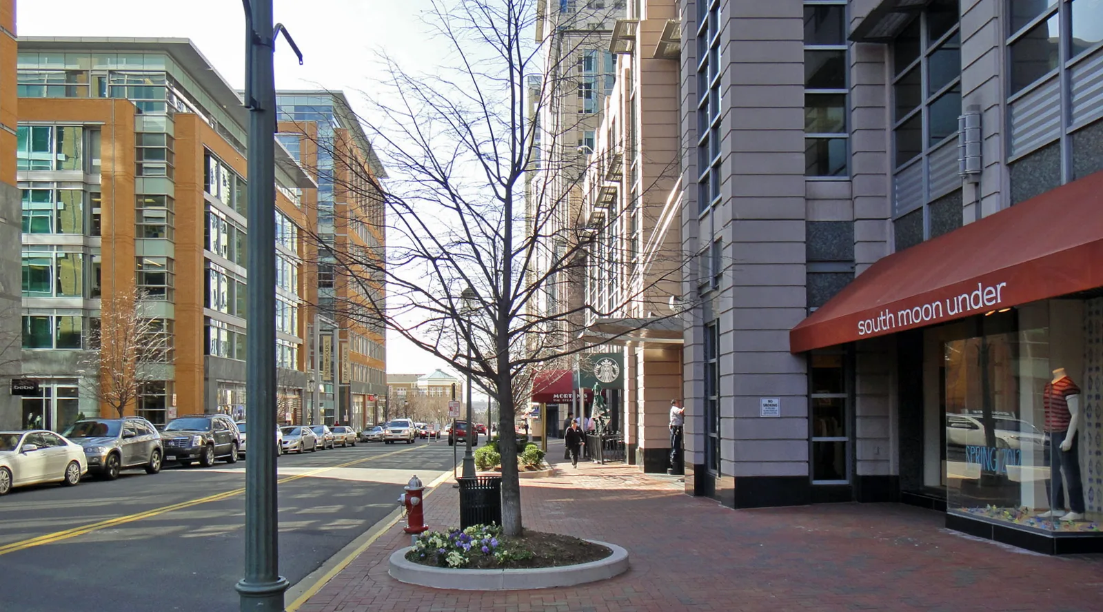 Storefronts and a coffee shop along Market Street at Reston Town Center.
