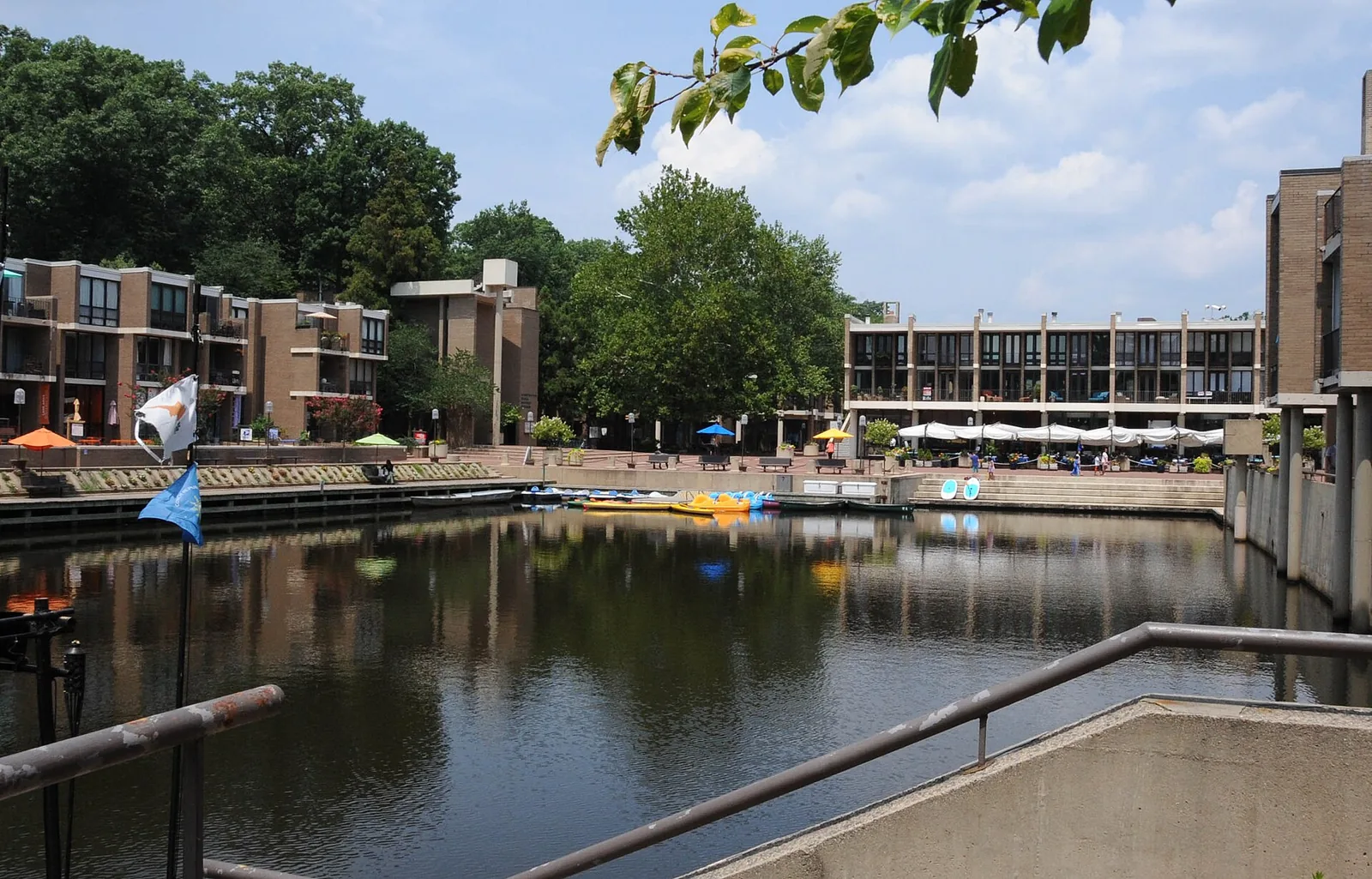 Lake Anne Plaza and its inlet in Reston, with the Washington Plaza Baptist Church at center; the Reston Farmers Market sets up on the plaza
