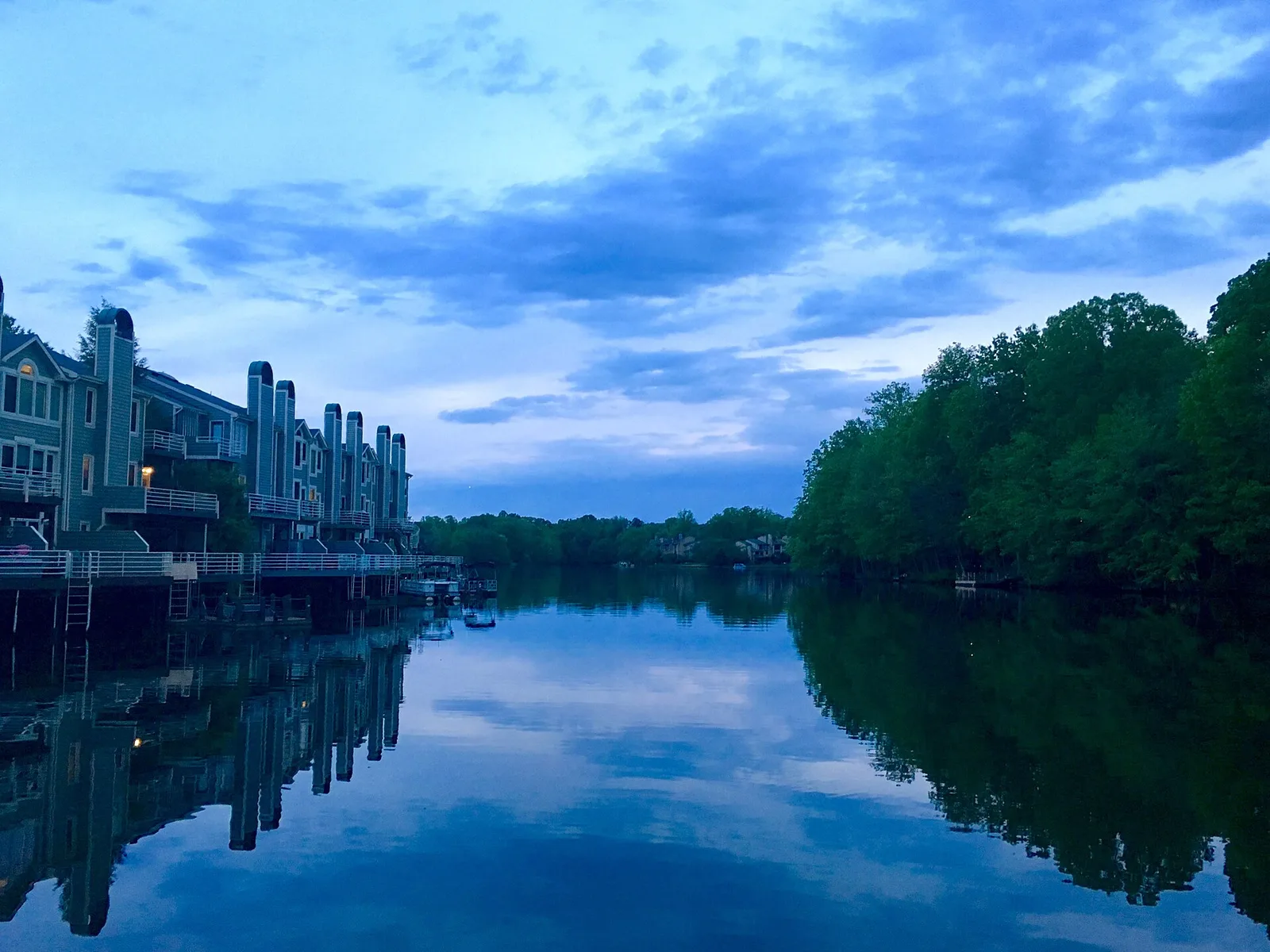 Homes along the shore of Lake Thoreau at sunset, looking south from near South Lakes Village Center in Reston